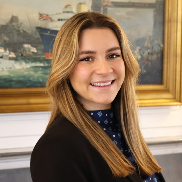 Woman in black suit.