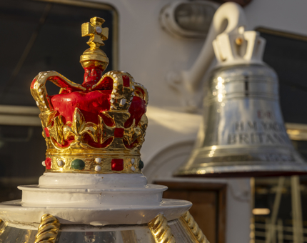 A close up of the crown in top of the decorative binnacle and Britannia's Bell. 