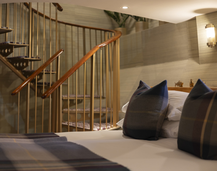 A duplex cabin aboard Fingal - there is a spiral staircase in the background. 