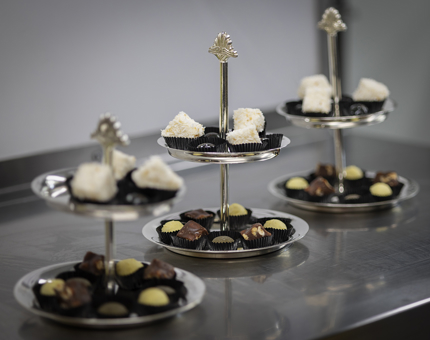 Three stands of petits fours. 