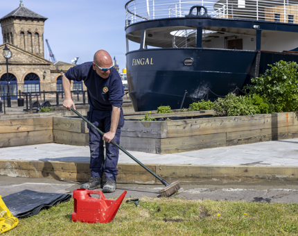 A Facilities Officer is creating a path in the herb garden on Fingal Hotel's quayside in the Port of Leith. 