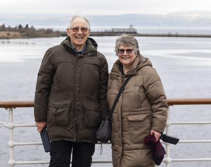 Visitors posing for a photo on the Verandah Deck.
