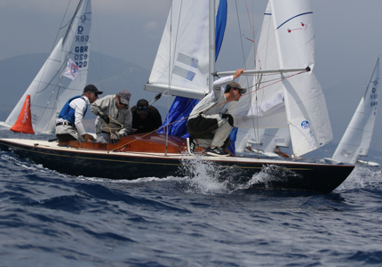 A crew sailing a boat in a race