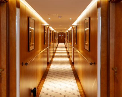 A long wooden panelled corridor aboard Fingal in Leith. 
