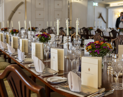 The State Dining Room table is set for an evening event on board. 