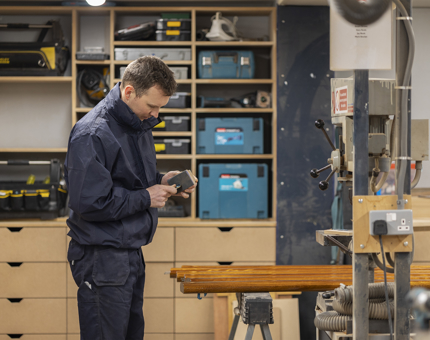 Greig filing the edges of the brass ends before fitting