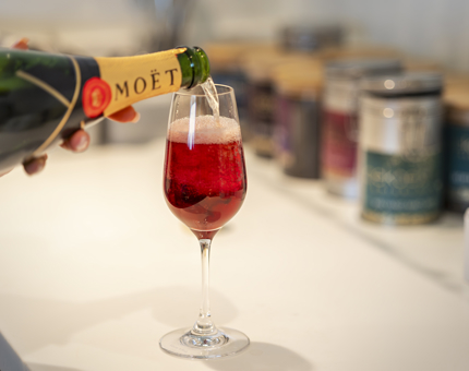 A Kir Royal cocktail being prepared.