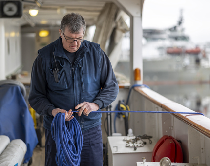 Tony prepping ropes to move the Berthing Cat