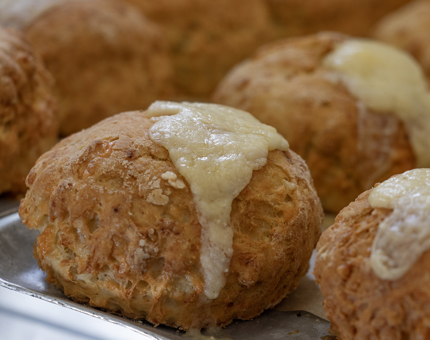 A tray of cheese scones. 