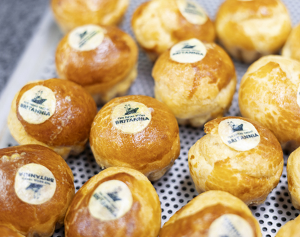 A tray of Profiteroles being prepared for an evening dinner event.