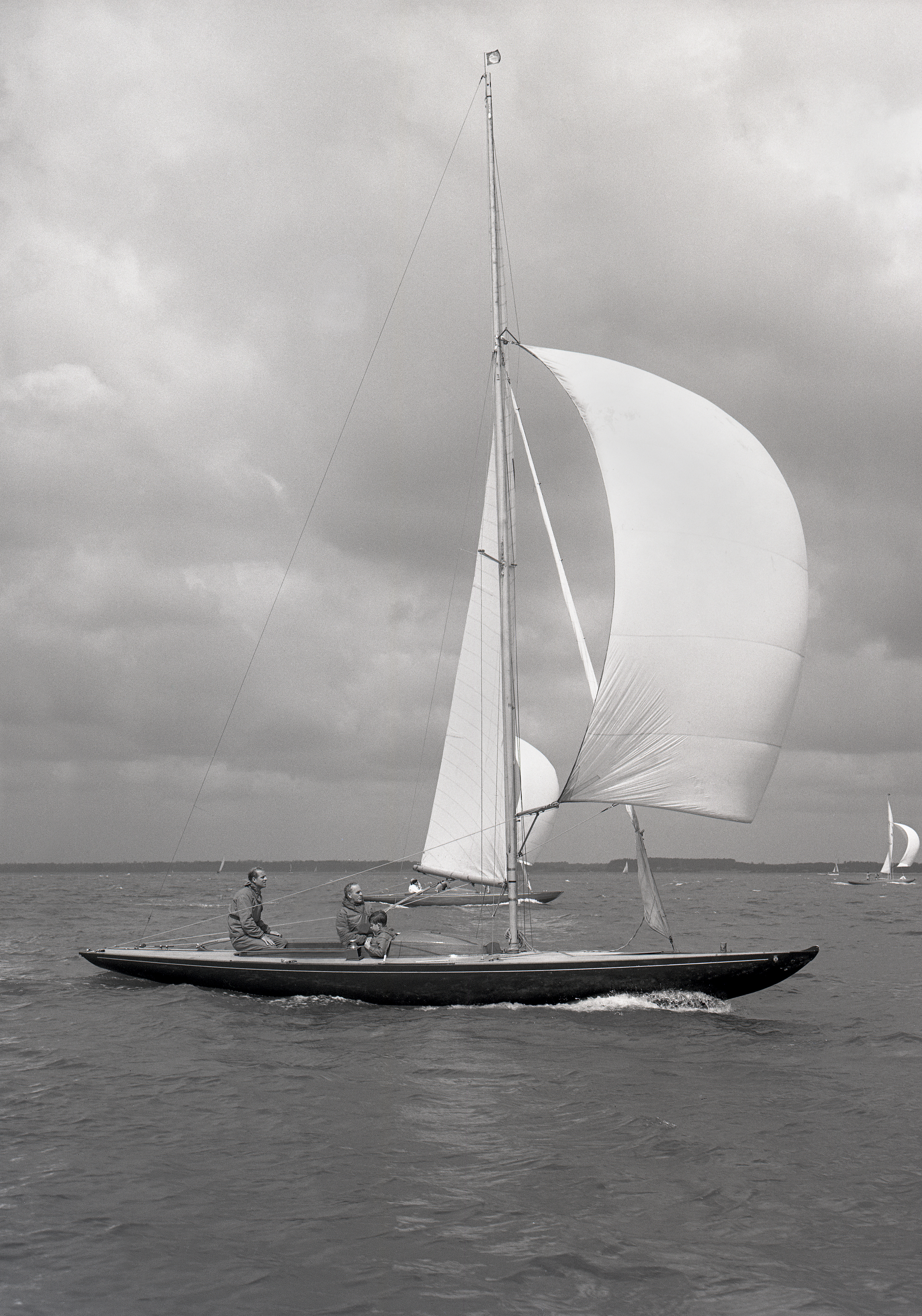 sailboat on water with sails up 
